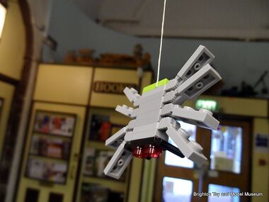 A Lego Halloween Spider dangling in the museum lobby, Halloween 2012