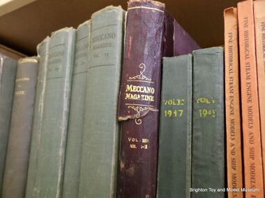 A shelf of 1920s/1930s bound copies of Meccano Magazine