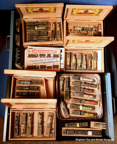 Part of the Museum's archived collection of Micromodels card steam locomotive models, stored in their traditional cigar-boxes
