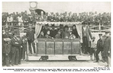 "'THE OPENING CEREMONY of Volk’s Electric Railway on August 3rd, 1883, attracted great interest. The car was started by the Mayor, who travelled on the first journey. The inventor, Mr. Magnus Volk, can be seen as conductor at one end of the car."