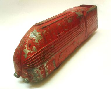 Red Coronation Class locomotive floor-toy, made by TTI, Stoke on Trent
