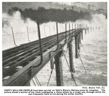 "FORTY MILLION PEOPLE have been carried on Volk’s Electric Railway since its inception. The picture shows a section of the track undergoing a fierce attack by a rough sea, through which the cars frequently have to run during the winter months."