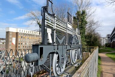 Angled view of the "Ghost Train" sculpture (left), with part of the Brighton Greenway in the background (right)