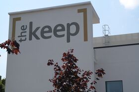 The Keep logo, painted on the building front