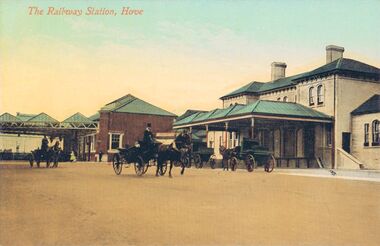 Old postcard image of Hove Station with horsedrawn traffic