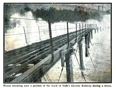 Waves breaking over the elevated and exposed Volk's Electric Railway track during a storm, Meccano Magazine 1937. Beach defences have since raised the height of the beach to match the height of the track.