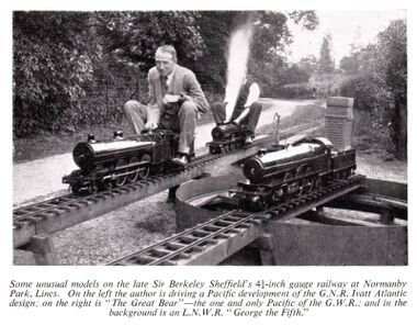 W.J. Bassett-Lowke rides a garden railway locomotive
