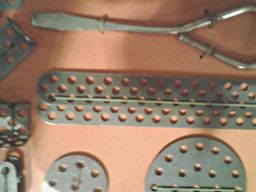 close-up of a Trix constructor set, showing the Trix system's three rows of holes