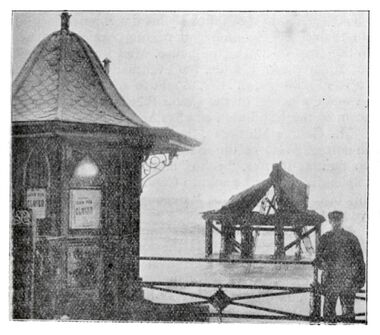 1896: "CHAIN PIER-CLOSED". A somewhat glum Edward Fogden, piermaster, Standing near a closed ticket kiosk