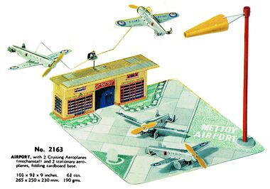 Airport, with two airborne planes and two parked planes, and a card base.