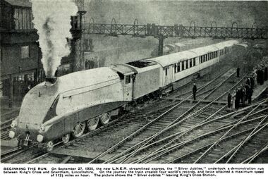 caption: BEGINNING THE RUN. On September 27, 1935, the new L.N.E.R. streamlined express, the "Silver Jubilee," undertook a demonstration run between King's Cross and Grantham, Lincolnshire. On the journey the train created four world's records, and twice attained a maximum speed of 112½ miles an hour. The picture shows the " Silver Jubilee "leaving King's Cross Station.