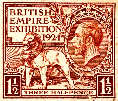 A red "Three Halfpence" postage stamp commemorating the British Empire Exhibition 1924, featuring a lion and a profile of George V