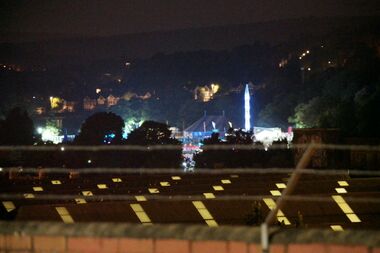 2018: The Britney Spears concert in Preston Park, seen from just over a kilometre away, from the embankment above Brighton Station. The stage area is out of sight, off to the right