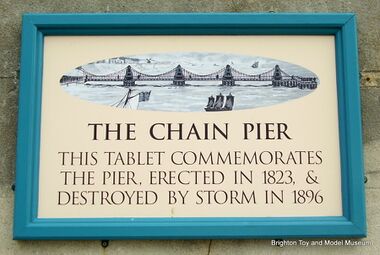 2010 replacement plaque marking the location where the Chain Pier used to meet the shoreline