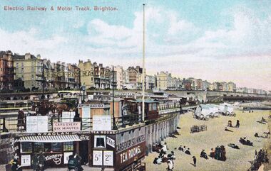1906 (postmark): With one very early motor car, all other vehicles are still horsedrawn. This is NOT the outcrop that held the Brighton Wheel, that was built later, further away ... this is almost next to the pier.
