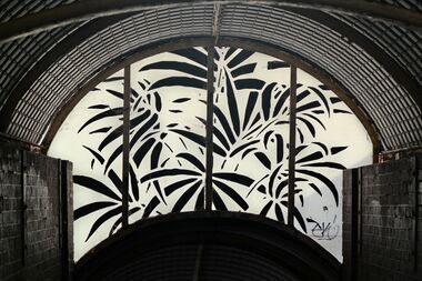 "Botanical" window decoration, inside the covered footbridge at Hove Station. Possibly a reference to Hove Park.