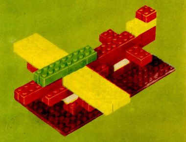 ~1953: Detail from a "Lego Mursten" set's box artwork, showing bricks with end-slots
