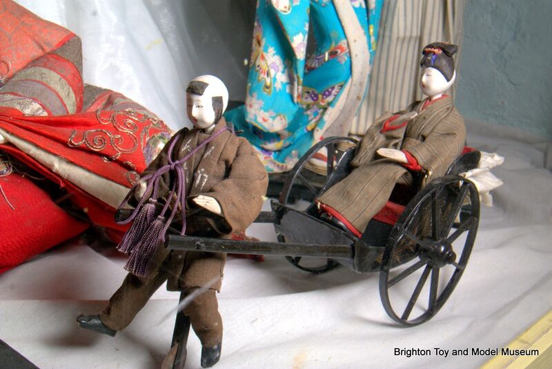 File:Man pulling woman passenger in handcart (Japanese Dolls).jpg