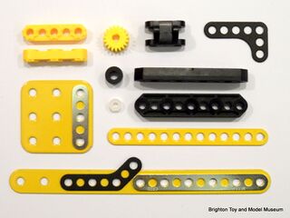 Some parts from a new Meccano Evolution set, showing original-sized and new "mini" parts