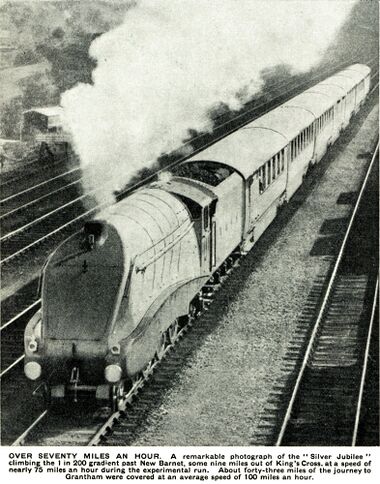 caption: OVER SEVENTY MILES AN HOUR. A remarkable photograph of the "Silver Jubilee" climbing the 1 in 200 gradient past New Barnet, some nine miles out of King's Cross, at a speed of nearly 75 miles an hour during the experimental run. About forty-three miles of the journey to Grantham were covered at an, average speed of 100 miles an hour.
