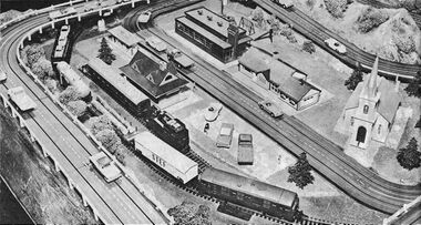 Playcraft Highways, Playcraft Railways, and Aurora plastic kits used together. Publicity photo from the back of the Playcraft Railways catalogue, circa 1962 or 1963