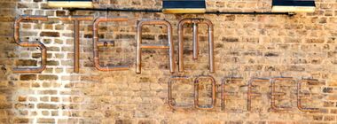 STEAM Coffee coffeehouse, copper tubing sign, Trafalgar Arches Corner, May 2015