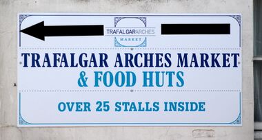 Trafalgar Arches Market signage, opposite in Trafalgar Street