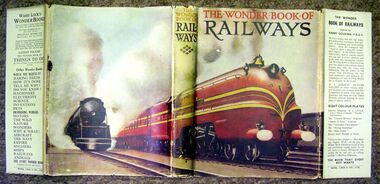 Cover of The Wonder Book of Railways, showing the red Coronation Scot in the US with bell and headlight, alongside an American locomotive
